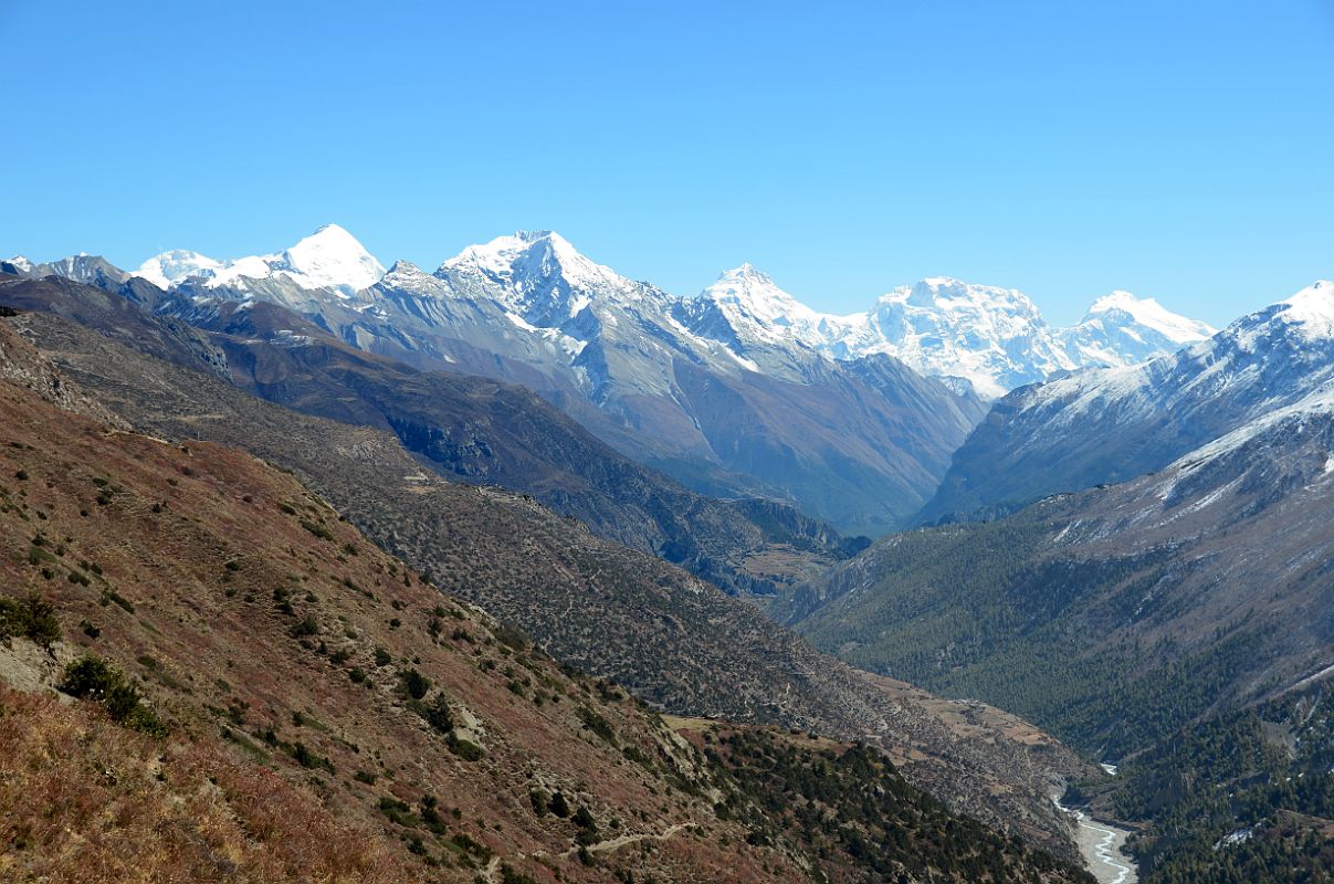 13 Looking Back Towards Manang With Kang Guru, Pisang Peak, Manaslu, Ngadi Chuli and Himalchuli Above On Trek From Tilicho Peak Hotel To Tilicho Tal Lake 